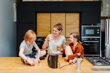 Kids enjoying a snack and drink at home. provided by mom after school