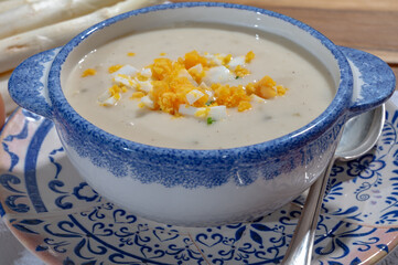 Bowl of homemade cream soup from white asparagus with eggs, spring season, new harvest of Dutch, German white asparagus, cooking with asparagus