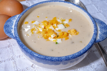 Bowl of homemade cream soup from white asparagus with eggs, spring season, new harvest of Dutch, German white asparagus, cooking with asparagus
