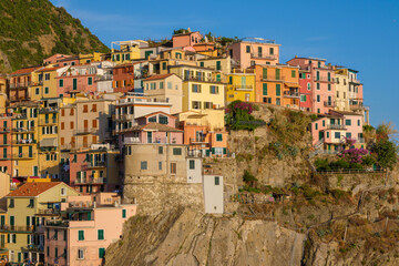 Fototapeta premium Colorful houses in Manarola village at sunset