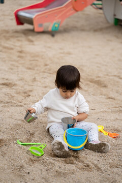 Toddler Playing in a Sunny Outdoor Playground