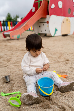 Toddler Playing in a Sunny Outdoor Playground