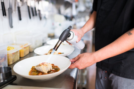 Chef flambe delicious healthy fish dish