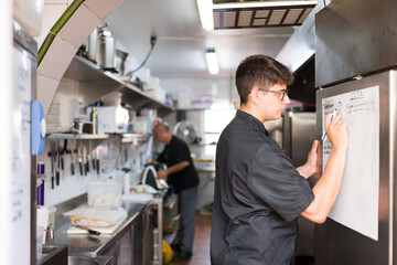Chef doing restaurant shopping list