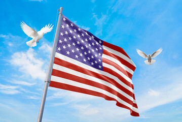 Waving flag of USA in beautiful sky and flying pigeons. USA flag for independence day. The symbol of the state on wavy fabric.