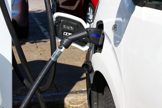 Vehicle being charged at public charging point