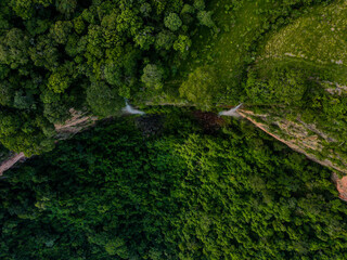 Aerial top down of waterfall in forest at Chapada dos Guimarães National Park in Mato Grosso