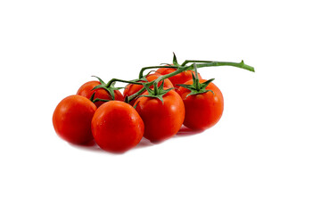 A group of seven red ripe tomatoes on a green branch lies on a white background