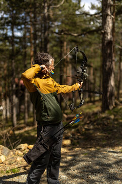 Portrait of a bowman in the woods