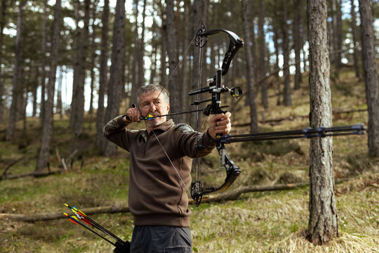 Portrait of an archer drawing a bow