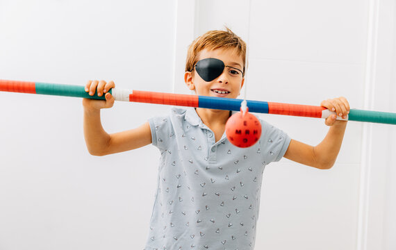 Boy undergoing vision therapy in optical clinic