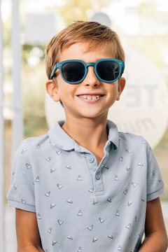 Smiling boy wearing glasses in eye care clinic