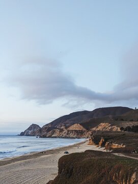 Cliffs rise over the beach