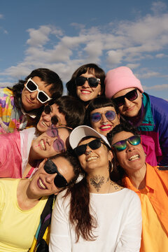 Portrait of mixed age range diverse women smiling