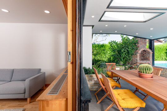 Modern house Veranda with skylight swimming pool and a living room 