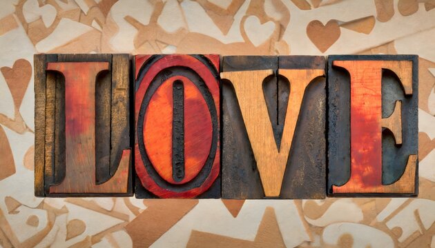 Love word in vintage old wood type. Banner header image. Wooden background.