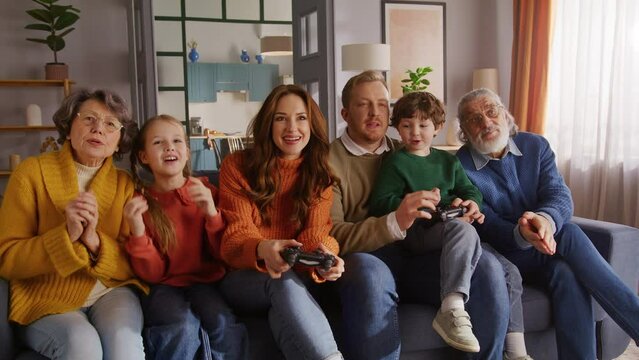 Retired lady cheering for woman playing game again husband