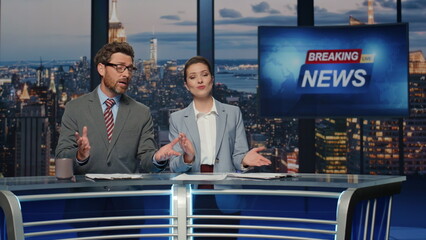Reporters hosting breaking news at evening tv closeup. Anchors ending broadcast