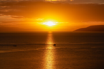 Silhouette of fishing boat with sunset view of Dalmatian archipelago seen from coastal town Makarska, Split-Dalmatia, Croatia, Europe. Coastline of Makarska Riviera, Adriatic Sea. Balkans in summer