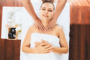 Obraz na płótnie Canvas Panorama top view woman customer enjoying relaxing anti-stress spa massage and pampering with beauty skin recreation leisure in day light ambient salon spa at luxury resort or hotel. Quiescent