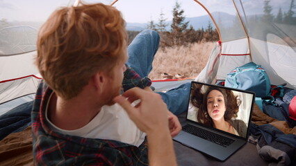 Travel man calling video chat in mountains closeup. Loving girl sending kiss