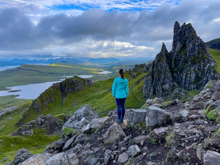 Female adventurer enjoys the breathtaking views on the way to Old Man of Storr