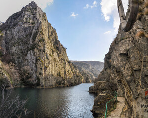 Matka is one of the most popular outdoor destinations in North Macedonia and is home to several monasteries. The Matka Lake within the Matka Canyon is the oldest artificial lake in the country. - obrazy, fototapety, plakaty