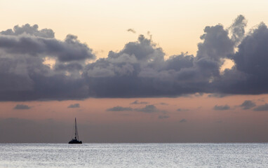 Sailboats and Yachts in Ocean at Sunset
