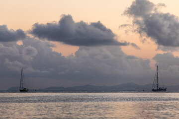 Sailboats and Yachts in Ocean at Sunset