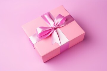 A pink gift box tied with a luxurious purple satin ribbon on a lavender background, symbolizing thoughtfulness and celebration.