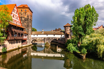 Colourful historic old town with half-timbered houses of Nuremberg. Bridges over Pegnitz river....