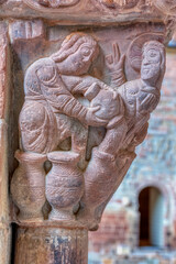 Romanesque capital of the Wedding of Cana in the Romanesque cloister of the monastery of San Juan de la Peña in Huesca.