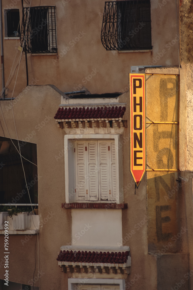 Poster Phone sign on a residential building in Sousse city, Tunisia