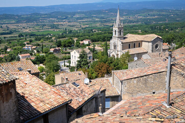 View with High church of St Gervasius and St Protasius in Bonnieux town, Provence region, France