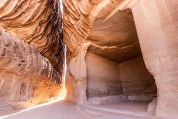 Narrow pasage through Jabal Ithlib mountain, the Siq, next to The Diwan, rock-cut chamber, at Hegra (Mada'in Salih) site near Al Ula, Saudi Arabia