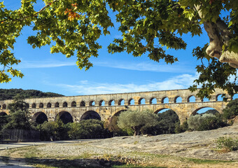 ancient Roman bridge Pont du Gard over Gard river near Vers-Pont-du-Gard town, France
