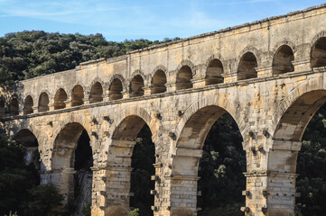 Famous ancient Roman bridge Pont du Gard over Gard river near Vers-Pont-du-Gard town, France