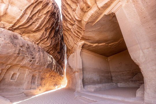 Narrow pasage through Jabal Ithlib mountain, the Siq, next to The Diwan, rock-cut chamber, at Hegra (Mada'in Salih) site near Al Ula, Saudi Arabia