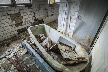 Bath tube in sanatorium called Solnechny - Sunny in Pripyat ghost city in Chernobyl Exclusion Zone, Ukraine - obrazy, fototapety, plakaty