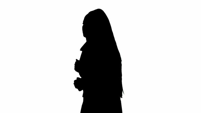 Female reporter black silhouette on white background with alpha channel. African American woman news host in suit running in front of camera.