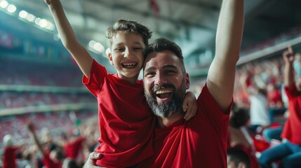 Cheerful father and son cheer for their favorite team on the football stadium. Football concept