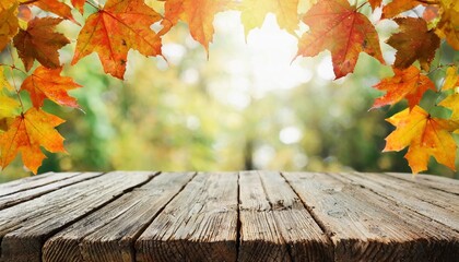 Naklejka na ściany i meble wooden table with orange fall leaves autumn natural background