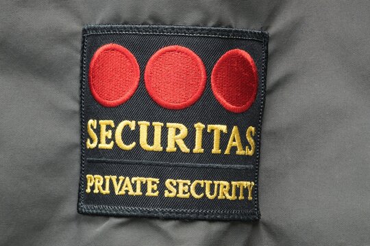 Securitas Security Services emblem logo isolated on a jacket sleeve in Houston, TX USA on 12-27-2023. Global security company founded in Sweden 1934.	