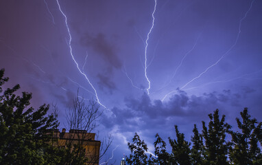 Lightning strike during a thunderstorm on a summer night in Warsaw, Poland
