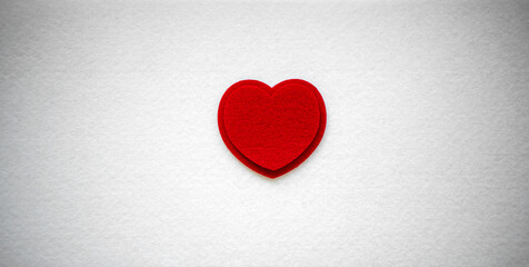 Red heart made of felt fabric.Needlework with your own hands. Red on white.A sign of love.