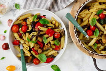Roasted vegetables pasta with zuccini, tomato  and Basil  .top veiw.selective focus