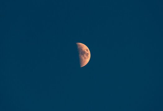 Dusk view of the waxing moon over Siete Picos, Spain