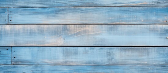 Detailed light blue old wooden wall texture with close-up of wood plank fence.