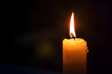 One lit candle on dark background - 759249763