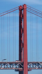 Lisbon 25 de Abril bridge red Tajo river engineering pillars stays tourism Portugal